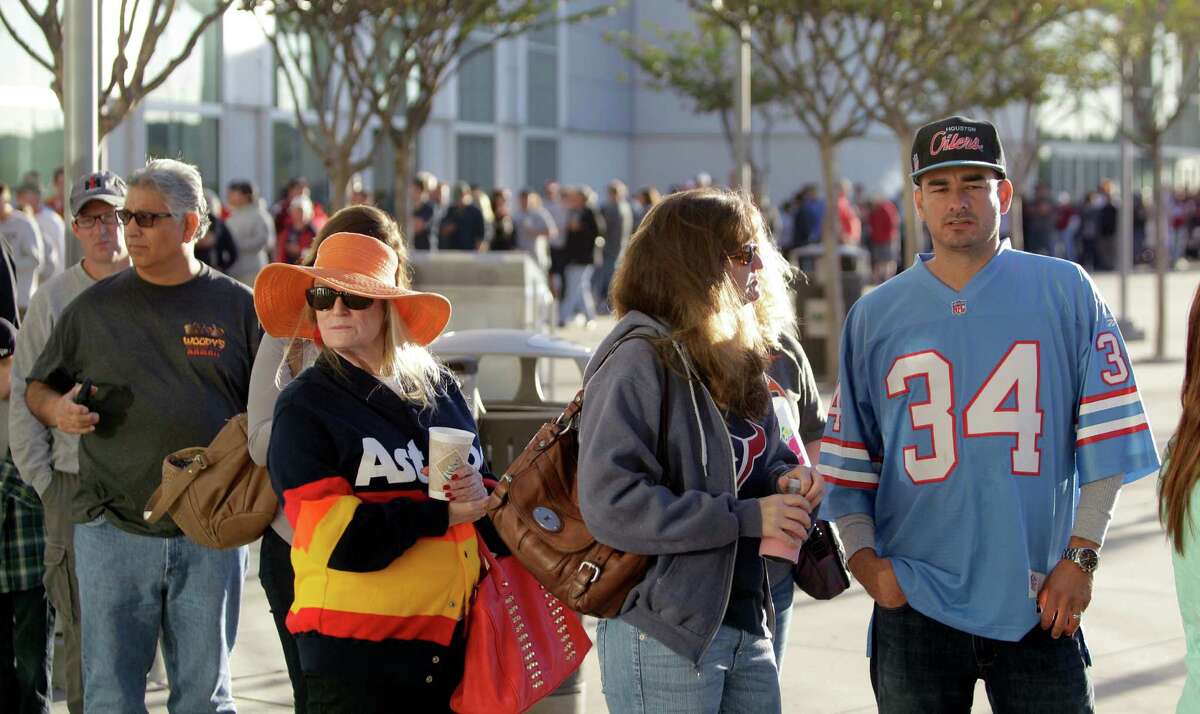 Dene Hofheinz, second from left, the daughter of the late Judge Roy Hofheinz, who was the mastermind behind the Astrodome, stands in line with other fans including Leon Barrera, right, wearing an Oiler's Earl Campbell jersey, as they wait outside to enter.