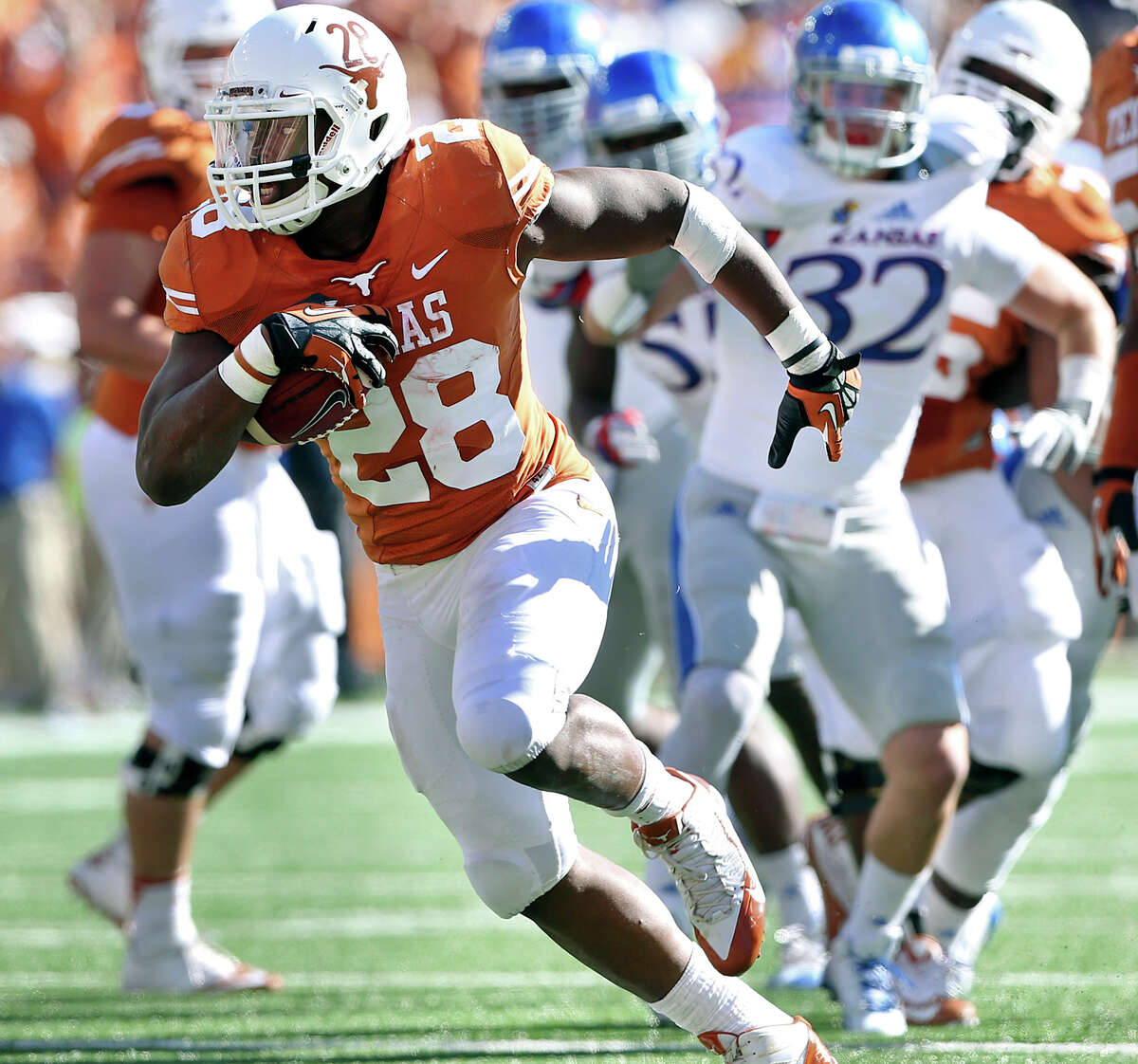Malcom Brown breaks to the open field in the first half as Texas hosts Kansas at Darrell K. Royal Stadium on November 2, 2013.
