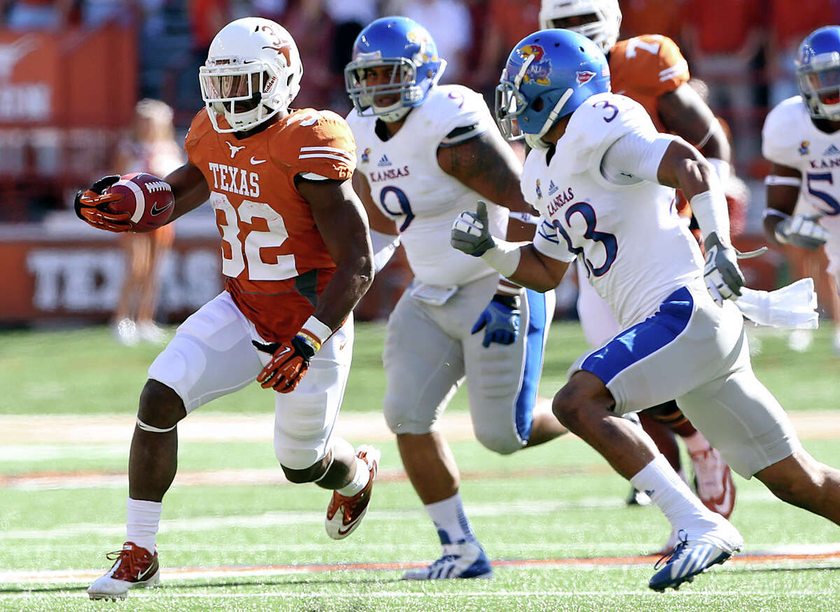 Johnathan Gray breaks to the open field in the first half as Texas hosts Kansas at Darrell K. Royal Stadium on November 2, 2013.