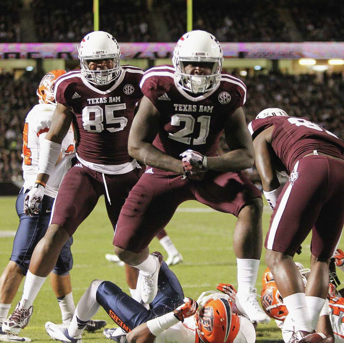 COLLEGE STATION, TX - NOVEMBER 02: Tra Carson #21 of the Texas A&M Aggies celebrates after scoreing in the first quarter against the UTEP Miners at Kyle Field on November 2, 2013 in College Station, Texas.