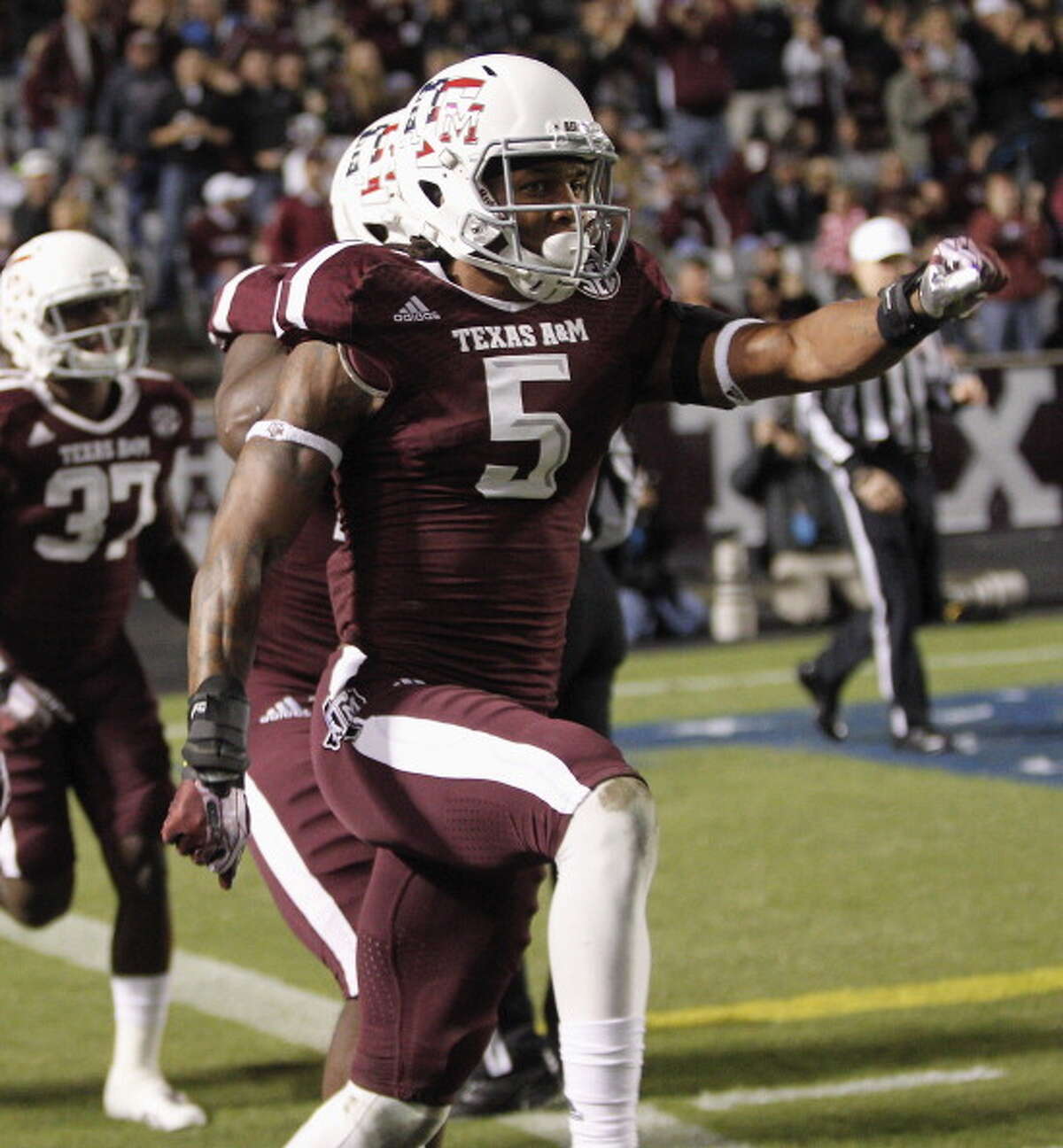 Floyd Raven Sr. #5 of the Texas A&M Aggies celebrtaes after blocking a punt by UTEP Miners for a safety in the first quarter at Kyle Field on November 2, 2013 in College Station, Texas.