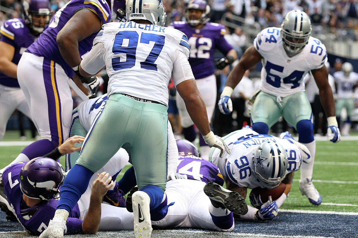 Dallas Cowboys' Nick Hayden, (96), recovers a fumble after Minnesota Vikings' quarterback Christian Ponder is sacked in the end zone during the second half at AT&T Stadium, Sunday, Nov. 3, 2013. The Cowboys won, 27-23.