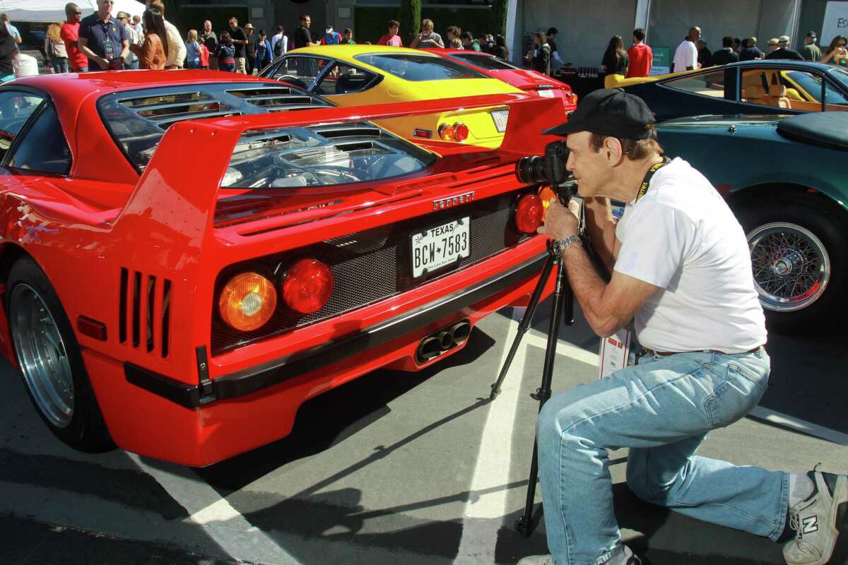 (For the Chronicle/Gary Fountain, November 3, 2013) Andy Solomon photographing detail on a Ferrari F40 at the Highland Village Ferrari Festival. The book he authored, "Autochrome," is a book of his photographs and is a fine art approach to classic cars.