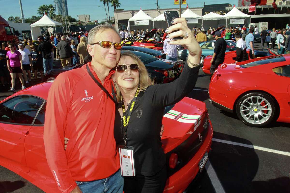 (For the Chronicle/Gary Fountain, November 3, 2013) Mike and Ronna Hardage doing a self-portrait in front of their Ferrari Challenge Stradale at the Highland Village Ferrari Festival.