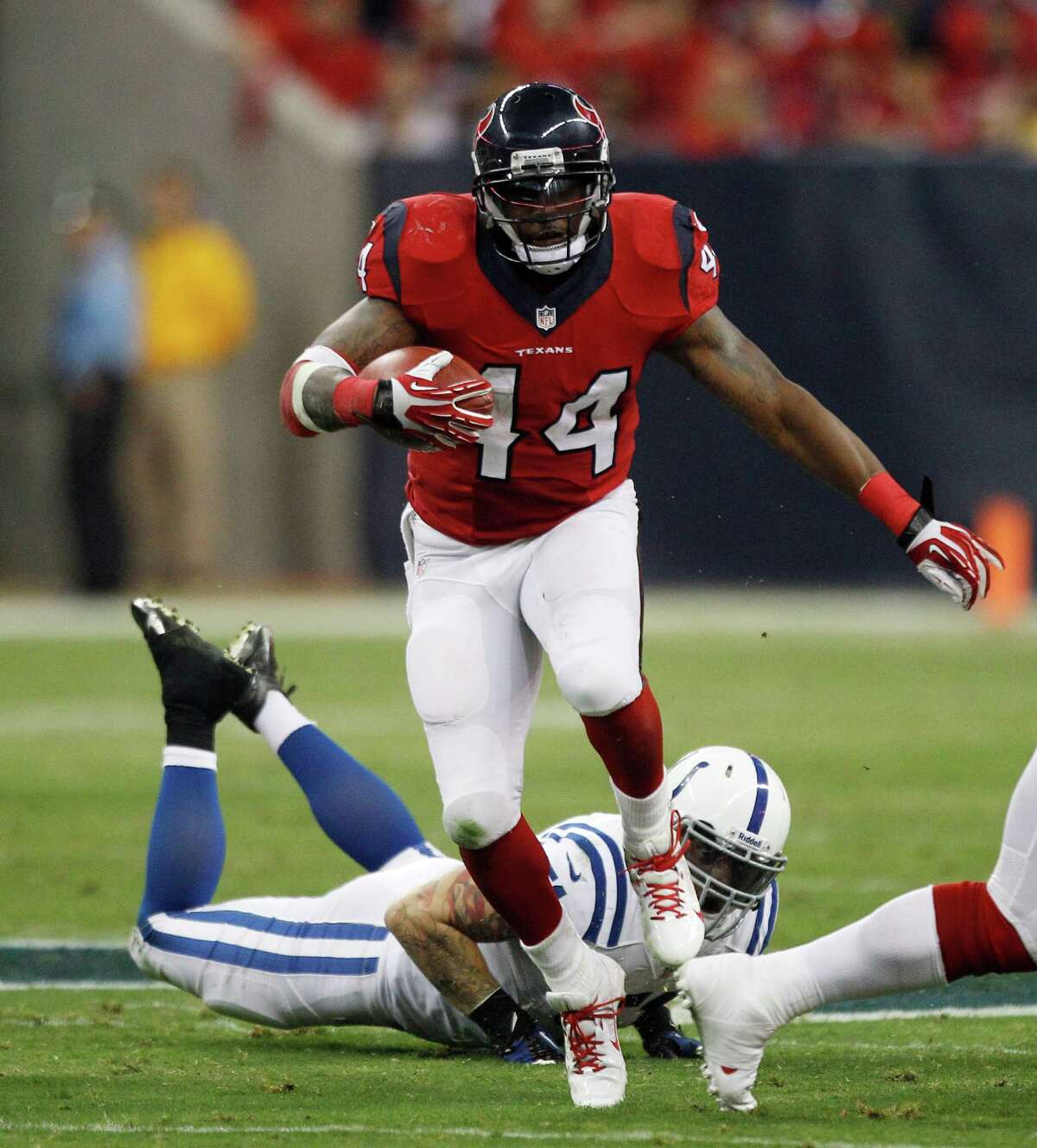Four cracked ribs didn't keep Texans running back Ben Tate (44) from going right at the Colts on Sunday night. He carried 22 times for 81 yards.