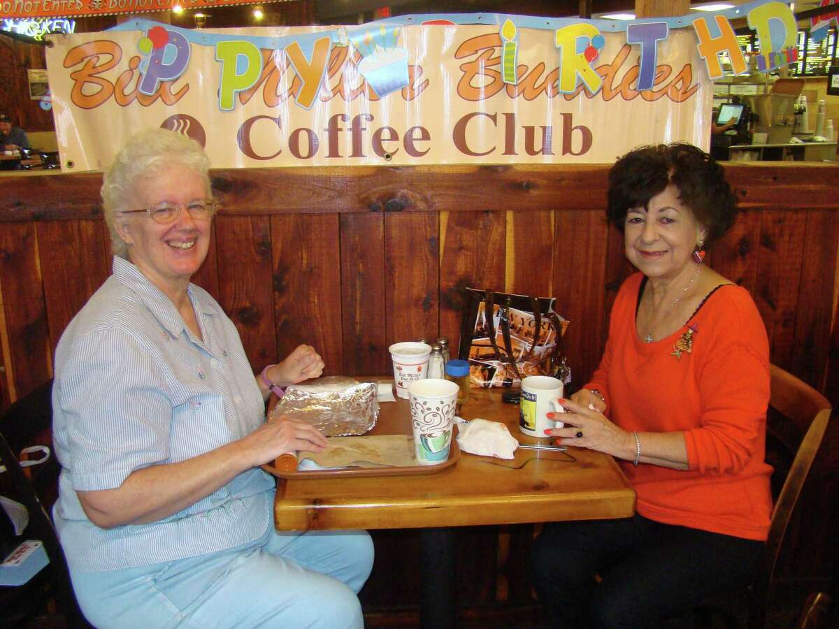 Kate Leigh, left, and Gloria Rios, of the Bill Miller Buddies Coffee Club, enjoy visiting during October's gathering. After 12 years, the club is disbanding.