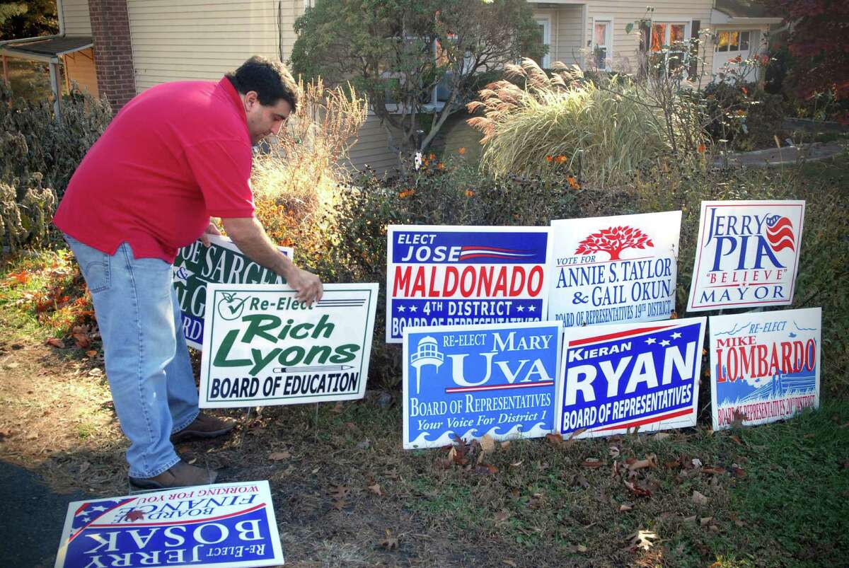 Vincent Murace runs a graphic design business from his Stamford, Conn. home and works on campaign signs and related campaign items. He's photographed on Monday November 4, 2013.