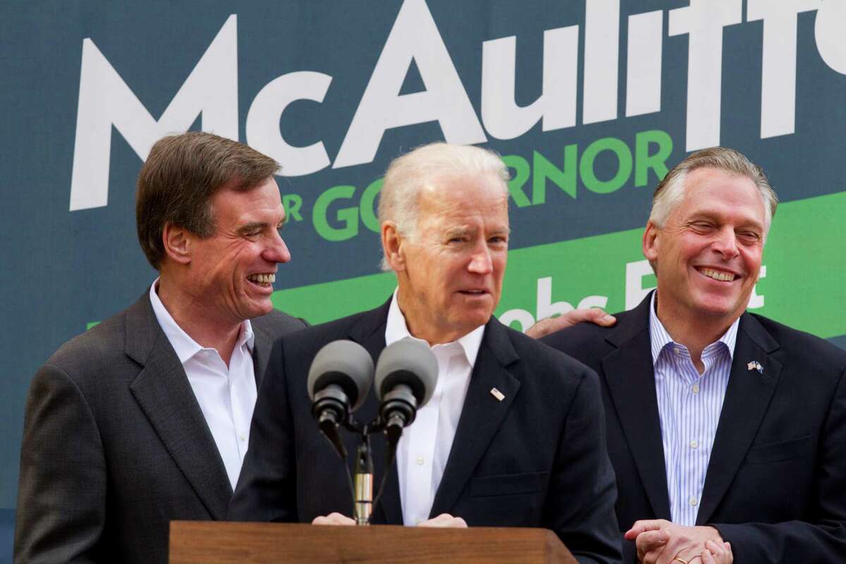 Vice President Joe Biden, accompanied by Sen. Mark Warner, D-Va., left, campaigns for Virginia Democratic gubernatorial candidate Terry McAuliffe on Monday in Annandale, Va.