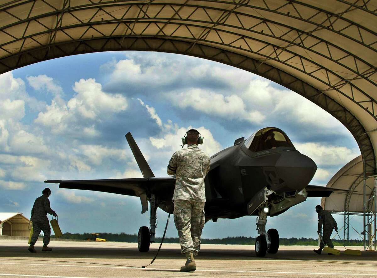 Airmen prepare to place chocks around the tires of an Air Force F-35 Lightning II joint strike fighter at Eglin Air Force Base, Fla., in 2011. Is it really needed?