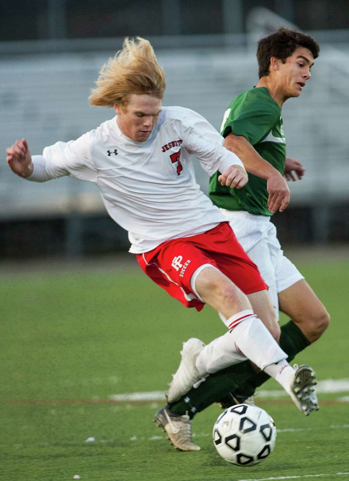 Fairfield Prep's Christopher Montani collides with New Milford high school's Nikolas Stefanatos during a first round game of the CIAC class LL boys soccer tournament played at Fairfield University, Fairfield, CT on Tuesday, November, 5th, 2013.