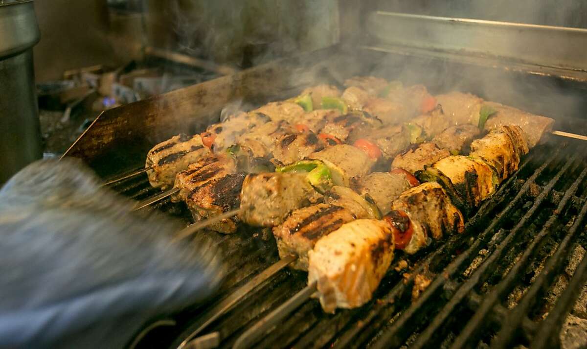 Kabobs cook on the grill at Roya Afghan Cuisine in Livermore, Calif. on Wednesday, October 30th, 2013.