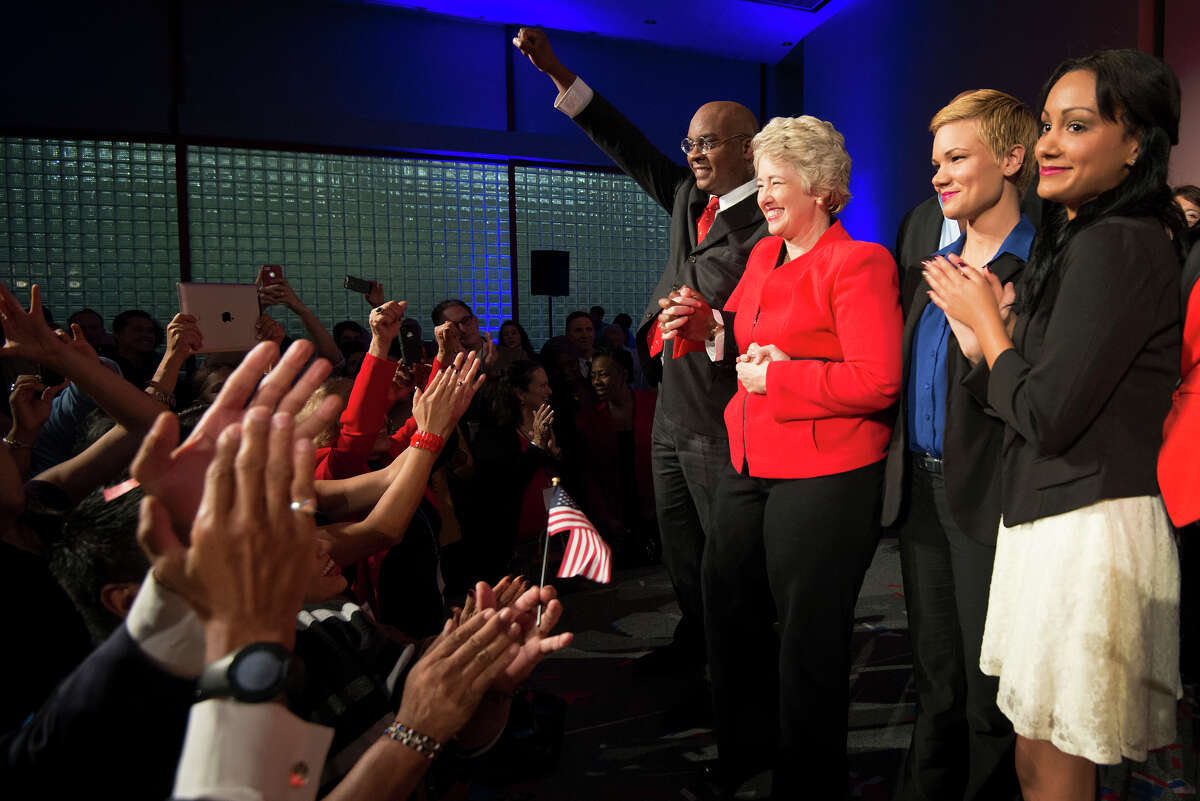 Houston mayor Annise Parker celebrates her election victory with her family during a campaign party at the George R. Brown Convention Center on Tuesday, Nov. 5, 2013, in Houston. ( Smiley N. Pool / Houston Chronicle )