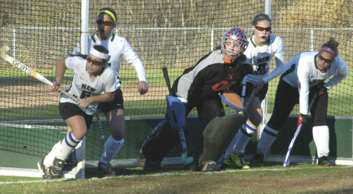 Defending the goal The New Milford HIgh School field hockey team was still alive this week for a state class 'L' title. Coach Dawn Hough's 12th-ranked Green Wave survived a taut, 1-0 duel Monday with visiting Norwalk in a playdown match at NMHS. Above, senior goaltender Denise Landry and her penalty corner teammates are poised for yet another stop on Norwalk's Bears. The Green Wave was scheduled Wednesday to visit fifth-ranked Glastonbury in a Round of 16 match. The winner would advance to the state 'L' quarterfinals today (Friday), Nov. 8. For the story and Green Wave photos, see the Nov. 15 edition of The Spectrum and updates at www.newmilfordspectrum.com.