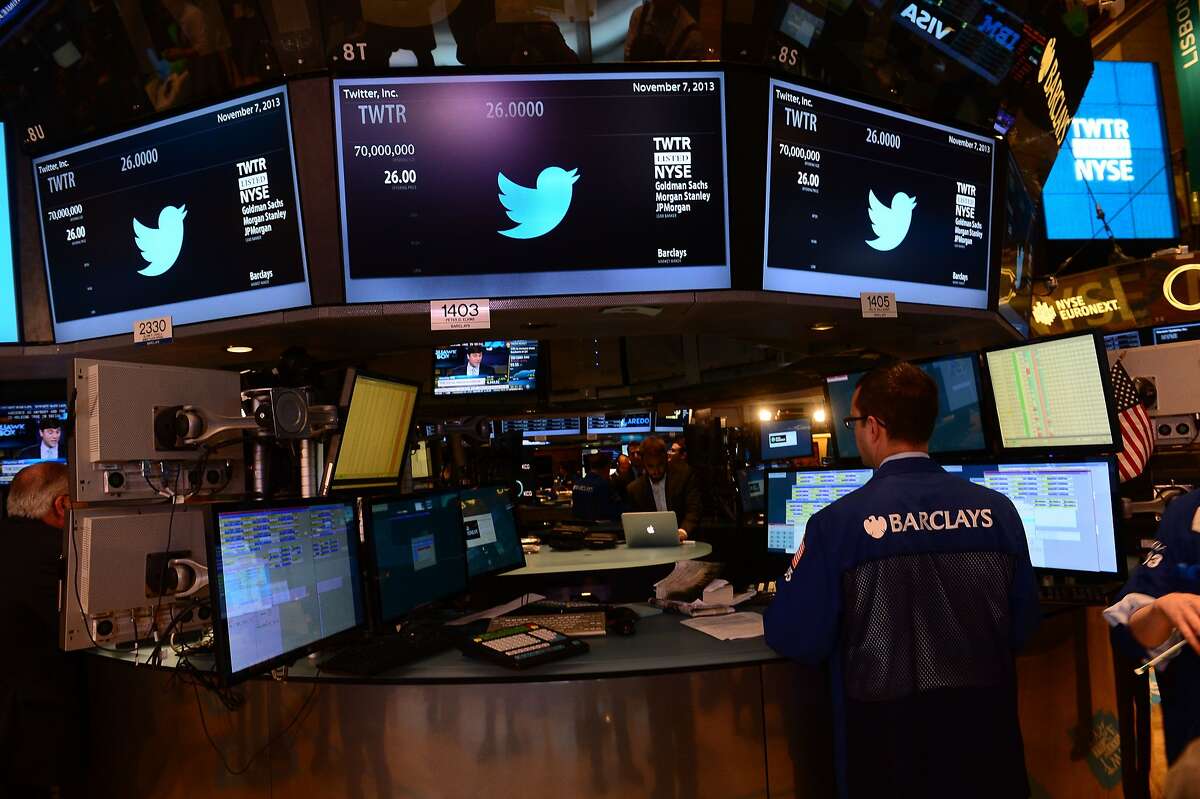 Traders are shown with the logo of Twitter and the symbol on which Twitter's stock will be traded (TWTR) on the floor of the New York Stock Exchange (NYSE) on November 7, 2013 in New York. Twitter goes public on the NYSE today,and is expected to open at $26 per share, making the company worth an estimated 18 billion USD. AFP PHOTO/EMMANUEL DUNANDEMMANUEL DUNAND/AFP/Getty Images