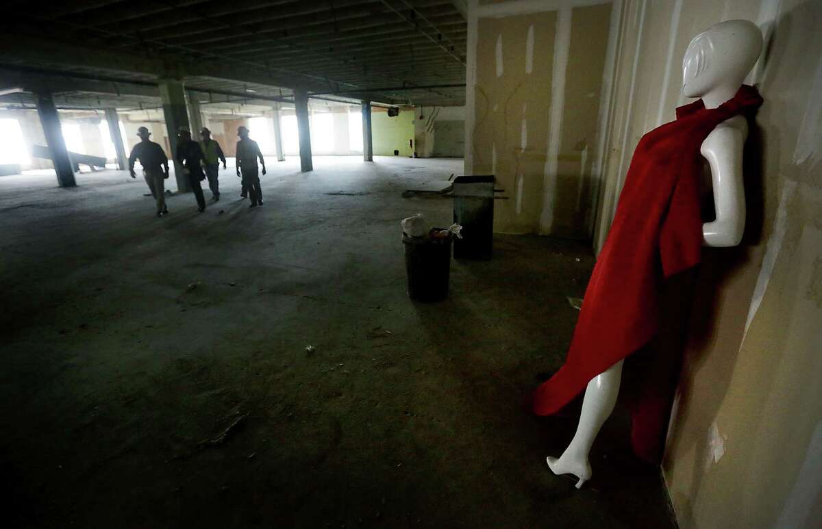 A mannequin draped in red fabric is a reminder of the fashion days at Joske's at the corner of Alamo and Commerce streets.