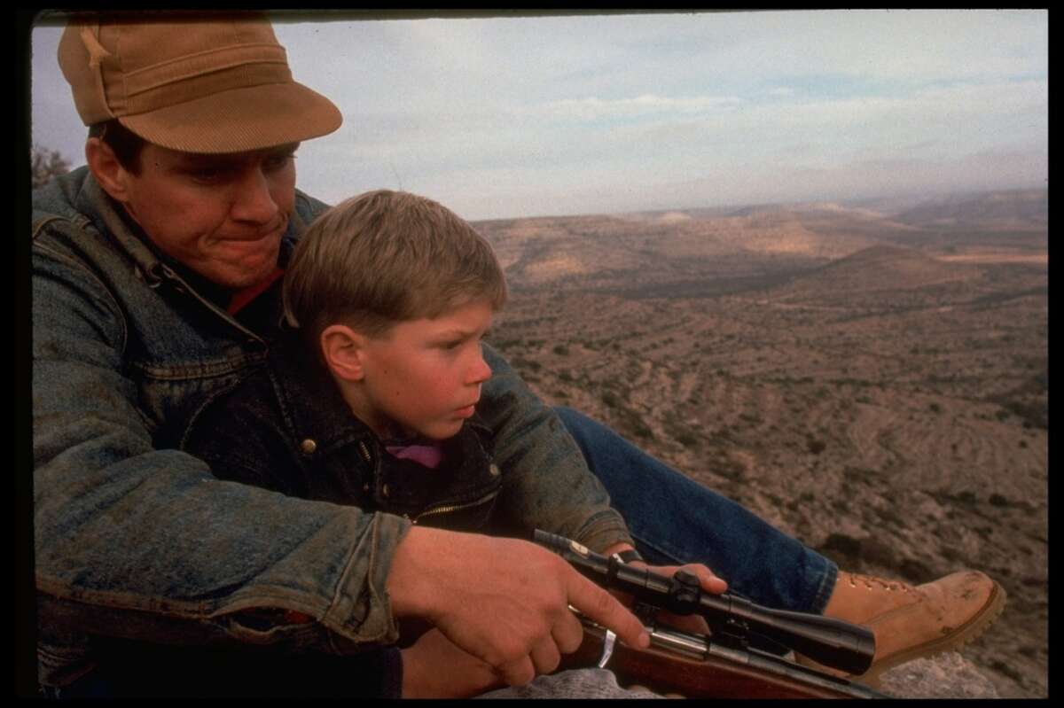 8-yr-old Kemper Cowden with father, Lynn, during first deer hunt & male initiation, near the Pecos Bend ranch in 1991.