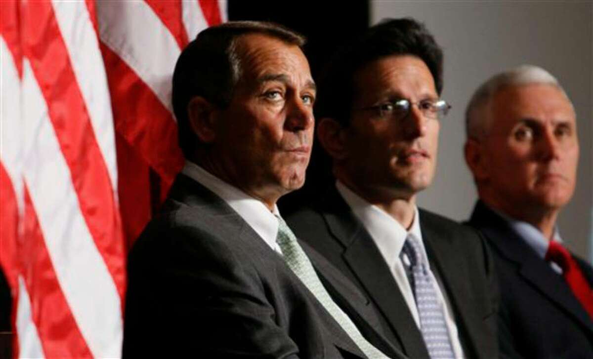 From left, House Minority Leader John Boehner of Ohio, House Minority Whip Eric Cantor of Va., and Rep. Mike Pence, R-Ind., listen as President Obama speaks to Republican lawmakers at the GOP House Issues Conference in Baltimore, Friday, Jan. 29, 2010. (AP Photo/Charles Dharapak)