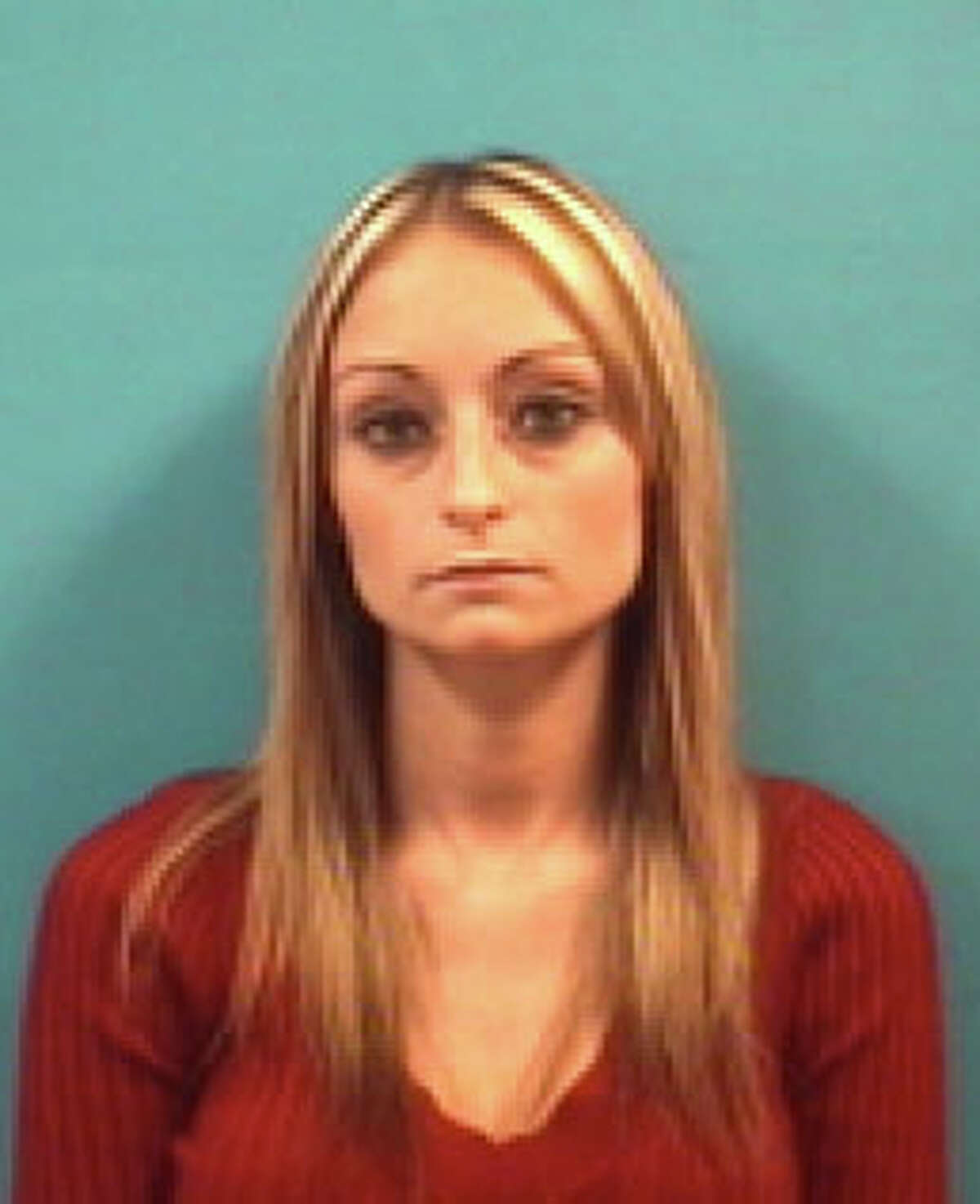 Julia Lack, 26, of Pearland, was arrested about noon Thursday by Pearland police and charged with one count of possession of child pornography. She is the girlfriend of Tad Jeremy Costin, 41, who was arrested Nov. 1 by a multi-agency group of law enforcement officers at his Pearland home. He has been charged with four counts of aggravated sexual assault of a child under age 14.