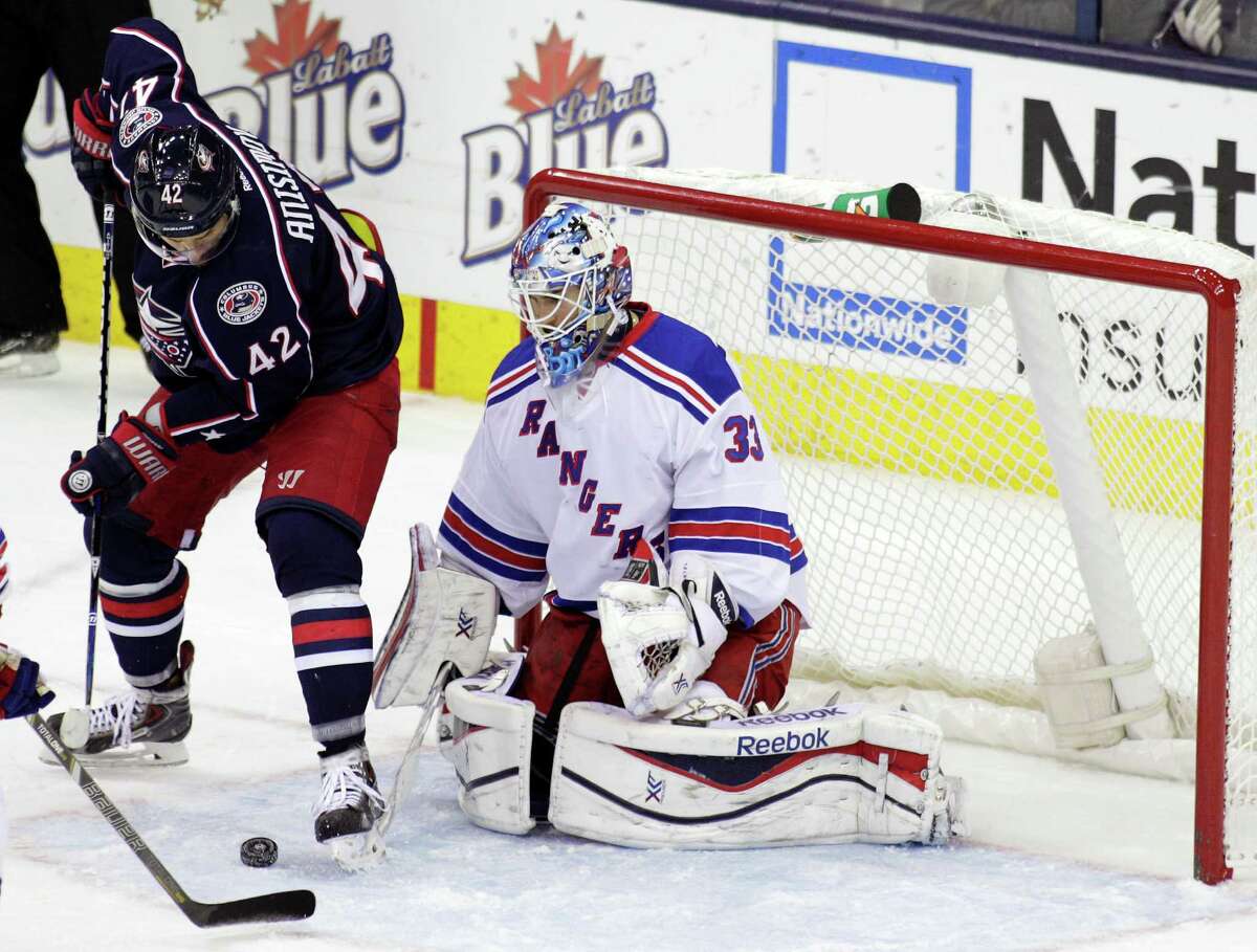 New York Rangers' Cam Talbot, right, makes a save against Columbus Blue Jackets' Artem Anisimov, of Russia, during the third period of an NHL hockey game Thursday, Nov. 7, 2013, in Columbus, Ohio. The Rangers beat the Blue Jackets 4-2. (AP Photo/Jay LaPrete) ORG XMIT: OHJL107