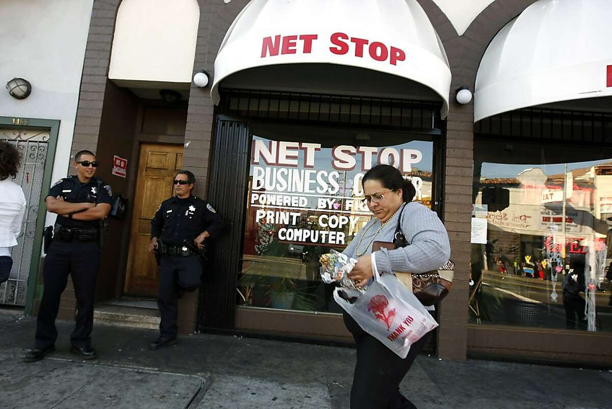 Police officers are seen outside Net Stop on Mission St. which part of a growing number of online gambling businesses that are drawing criticism from neighbors and supervisor John Avalos who say they are bring in an undesirable cliental which is leading to higher crime rates for the Excelsior District, in San Francisco, CA Thursday, October 31, 2013.