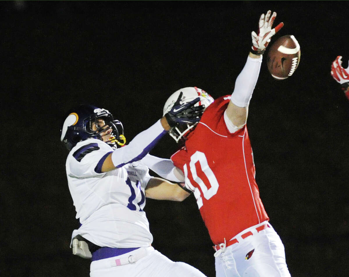 At right, Griffin Tiedy (# 40) of Greenwich breaks up a pass to Westhill receiver Evan Skoparantzos (# 11) during first quarter action of the high school football game between Greenwich High School and Westhill High School at Greenwich, Friday, Nov. 8, 2013.