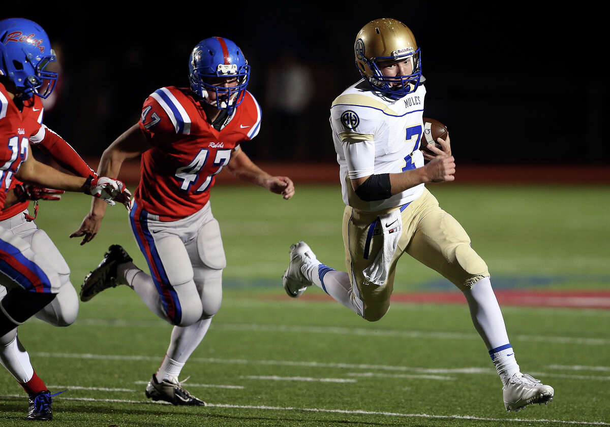 Mule quarterback Dalton Banks sprints to the outside on a run in the first half as Hays hosts Alamo Heights at Bob Shelton Stadium on November 8, 2013.