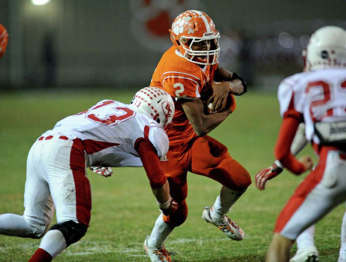 Orangefield's Carl Wiley (2) breaks away from Bridge City's Derrick Dearing (13) during a game this season. Wiley earned all-state second team honors on Tuesday. Enterprise file photo