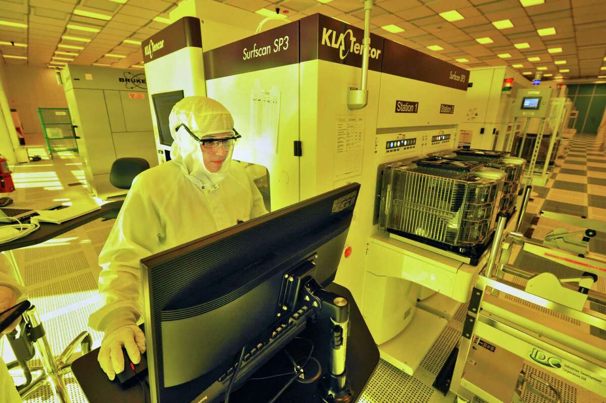 CNSE research tech Jamie Prudhomme operates a practical measuring system for the G450C wafer in Albany NanoTech's new NanoFab Xtension facility Wednesday Nov. 6, 2013, in Albany, NY. (John Carl D'Annibale / Times Union)