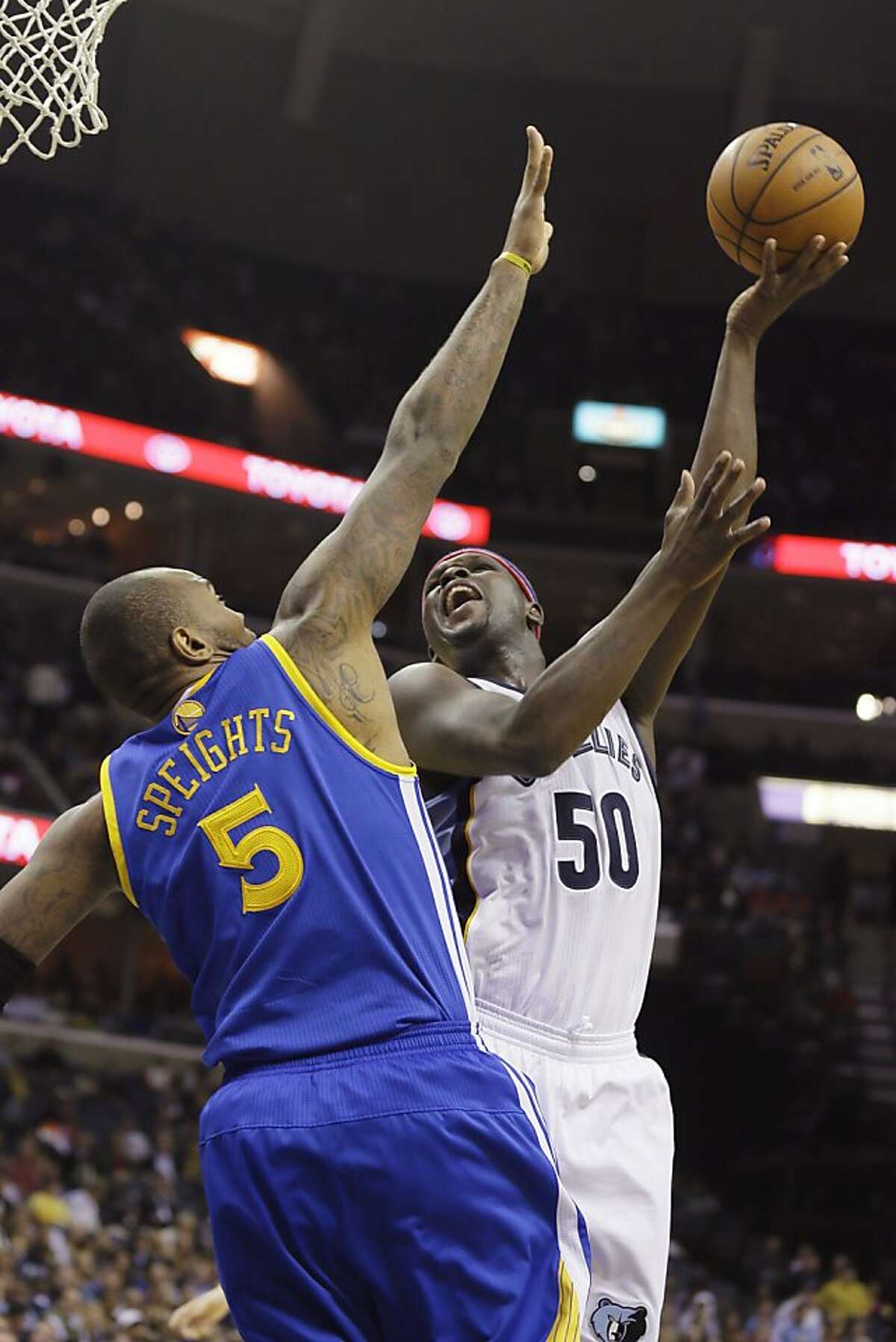 Memphis Grizzlies' Zach Randolph (50) shoots over Golden State Warriors' Marreese Speights (5) in the second half of an NBA basketball game in Memphis, Tenn., Saturday, Nov. 9, 2013. Randolph scored 23 points in the Grizzlies 108-90 victory over the Warriors. (AP Photo/Danny Johnston)