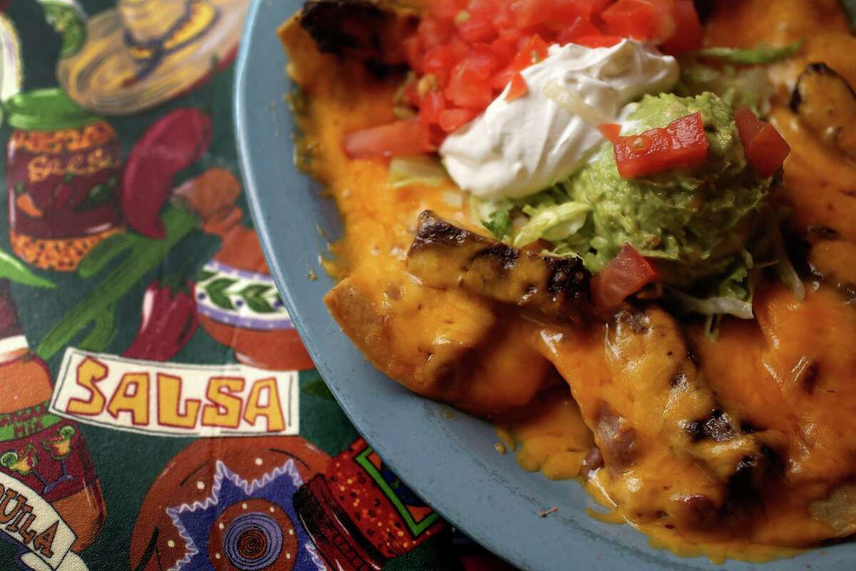 A plate of Mercy's Nachos (choice of beef or chicken fajitas topped with refried beans and choice of Monterey or Cheddar Cheese) at Lupita's Mexican Restaurant, Wednesday, Nov. 6, 2013, in Sugar Land. ( Karen Warren / Houston Chronicle )