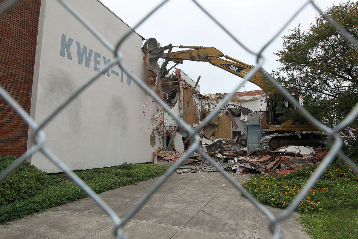 Heavy equipment is used to demolish the former Univision building after Judge Janet Littlejohn ruled to dissolve a temporary restraining order, Tuesday, Nov. 12, 2013. It cleared the way for demolition to continue. Developing company, Greystar, plans on building a $55-million 355-unit apartment on the site. Eight protesters were arrested trying to stop the demolition.