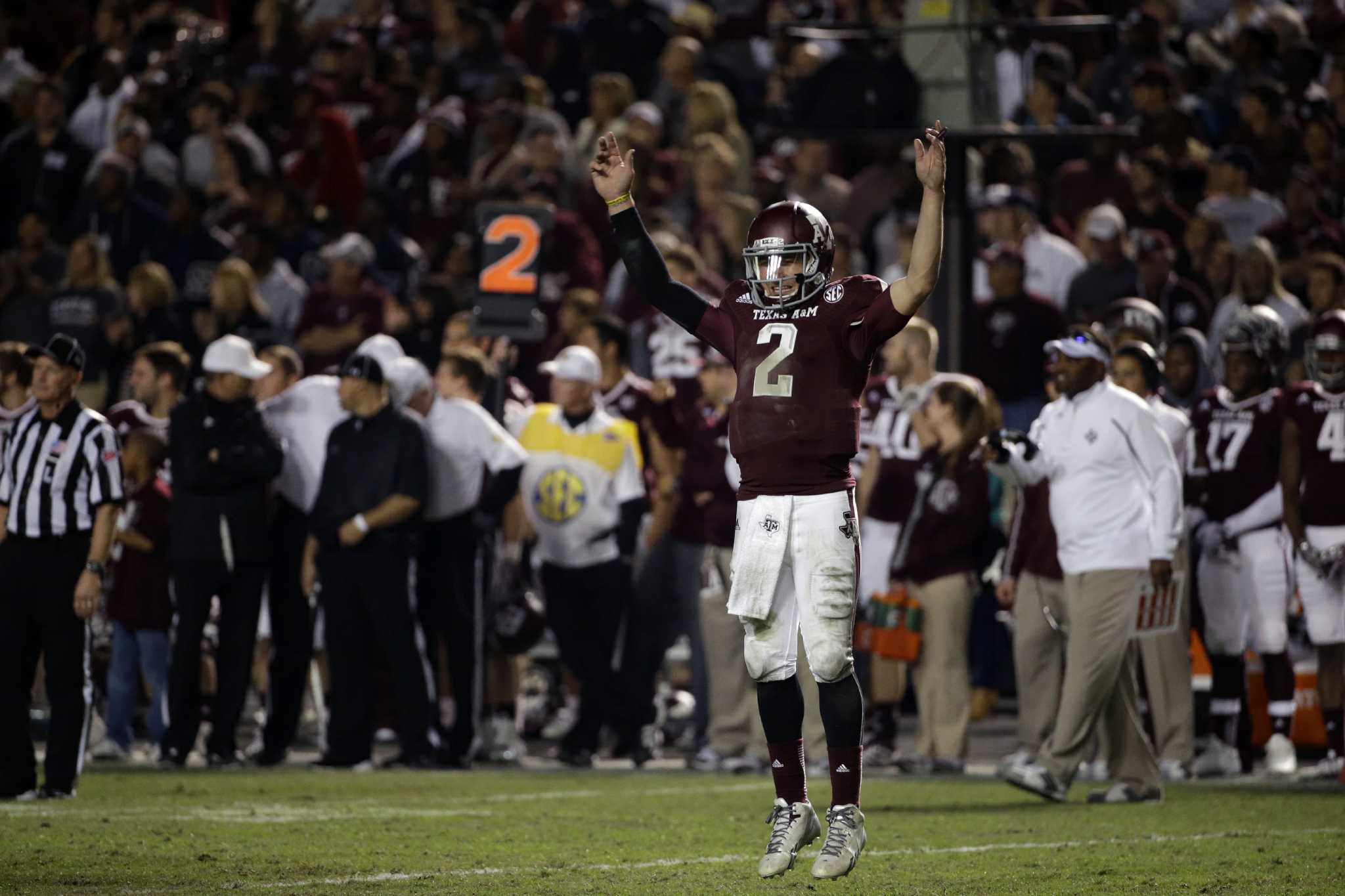 Johnny Manziel Tries To Calm Mike Evans On Texas A&M Sideline