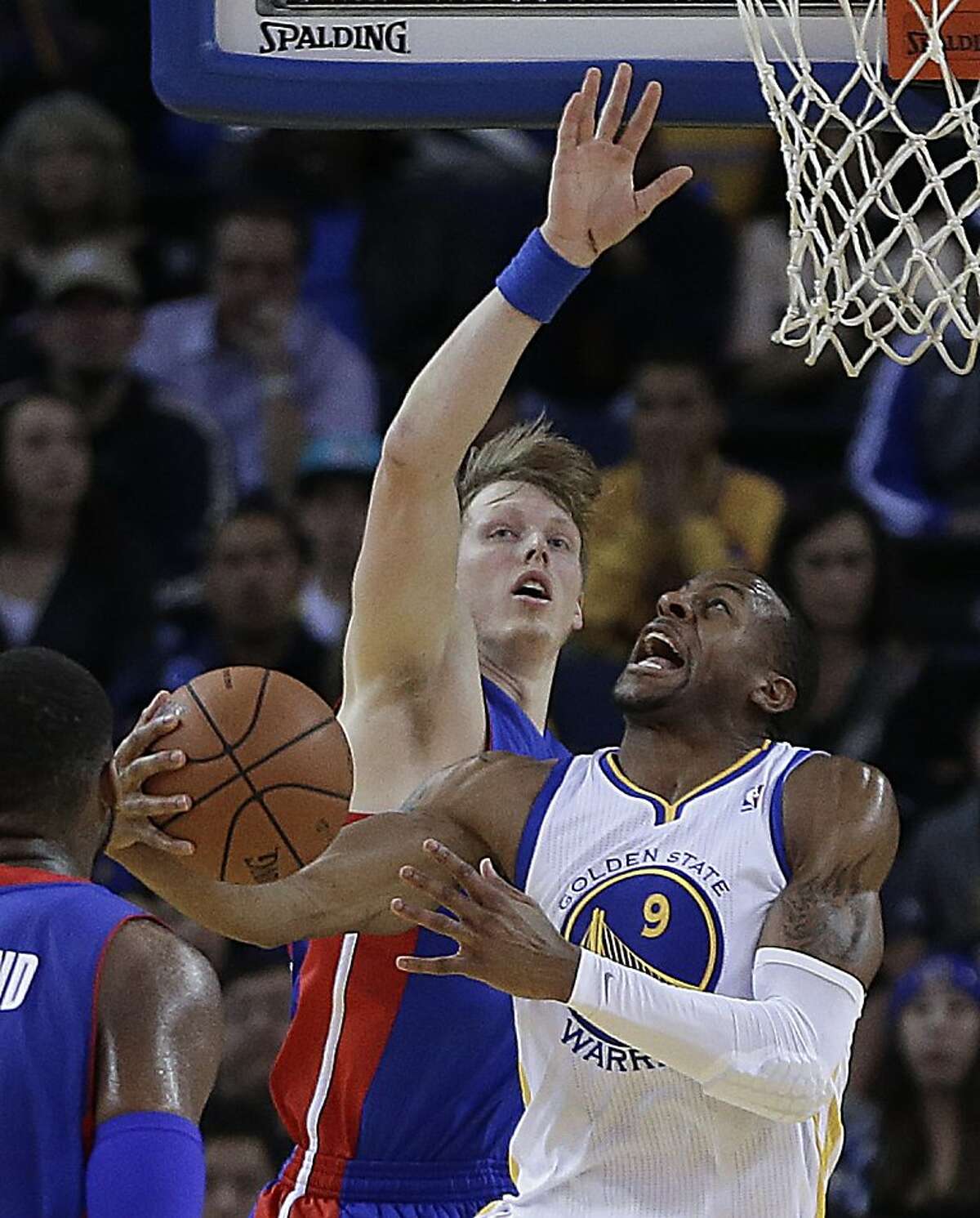 Golden State Warriors' Andre Iguodala (9) looks to shoot over Detroit Pistons' Kyle Singler during the first half of an NBA basketball game on Tuesday, Nov. 12, 2013, in Oakland, Calif. (AP Photo/Ben Margot)