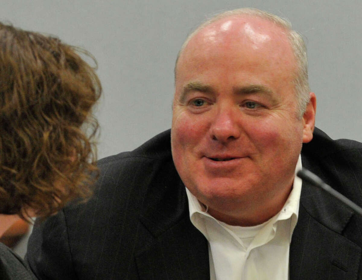 Michael Skakel, right, speaks to one of his defense attorneys, Jessica Santos, at Skakel's habeas corpus trial at State Superior Court in Vernon, Conn., on Tuesday, April 23, 2013.