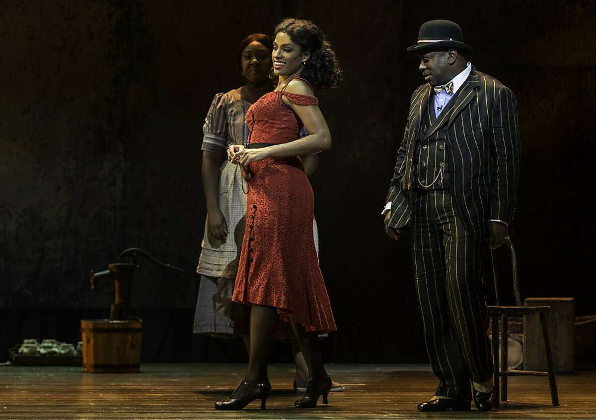 Sporting Life (Kingsley Leggs) tries to tempt Bess (Alicia Hall Moran) in "The Gershwins' Porgy and Bess" at Golden Gate Theatre