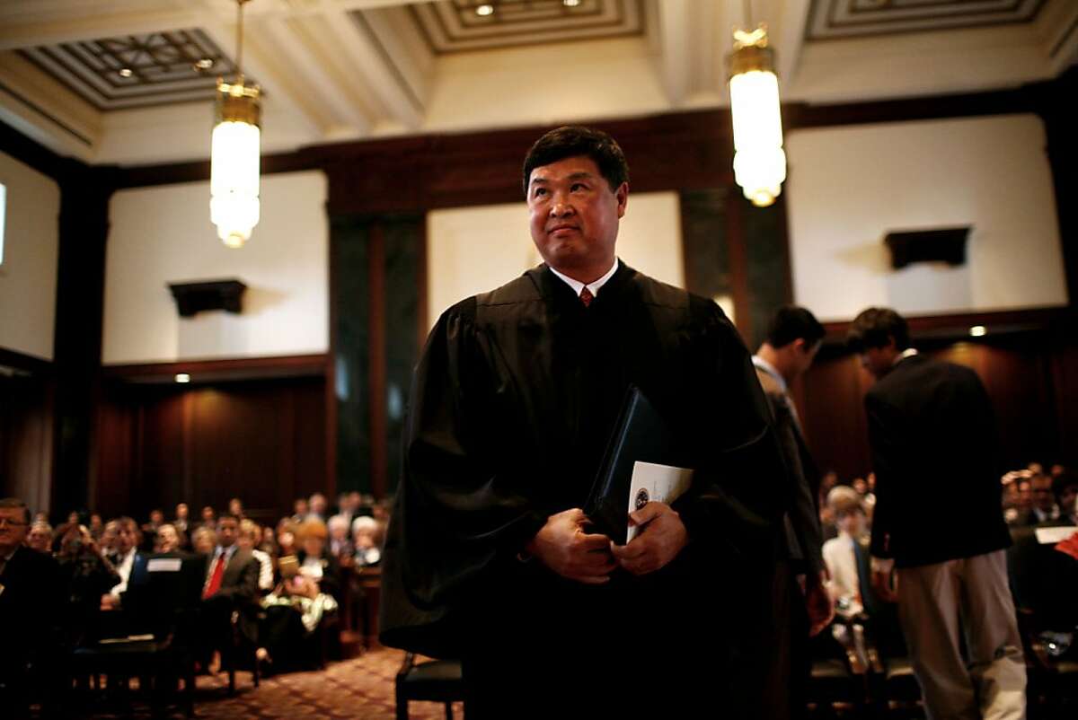 FILE-- U.S. District Court Judge Denny Chin is sworn in as a U.S. Court of Appeals judge, in New York, June 16, 2010. Googles' plan to digitize every book ever published and make them widely available was derailed on Tuesday when Judge Chin rejected a sweeping $125 million legal settlement the company had worked out with groups representing authors and publishers. Citing copyright, antitrust and other concerns, Judge Chin said that the settlement would have granted Google a "de facto monopoly" and the right to profit from books without the permission of copyright owners. (Todd Heisler/The New York Times)