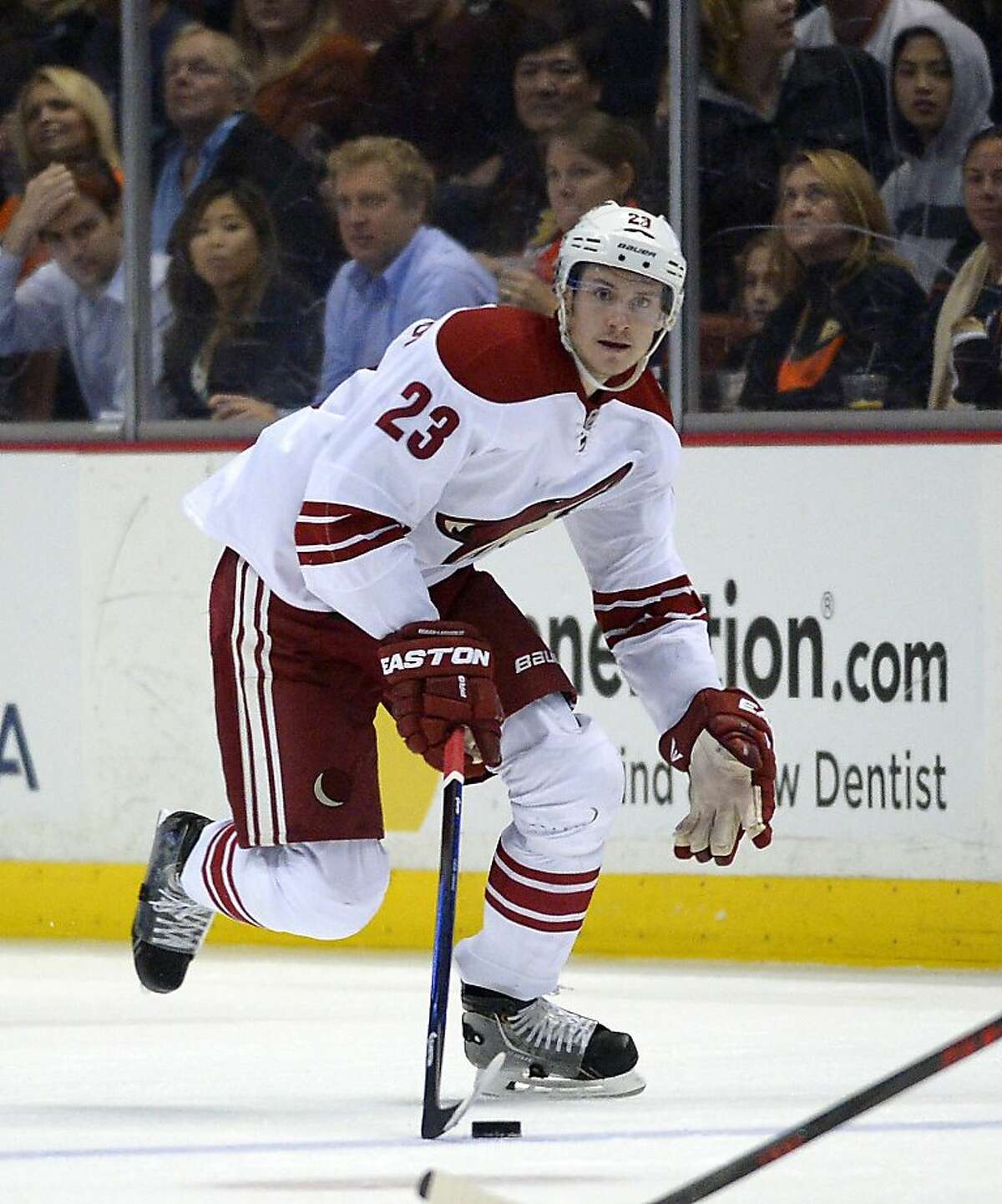 Phoenix Coyotes defenseman Oliver Ekman-Larsson, of Sweden, moves the puck during the third period of an NHL hockey game against the Anaheim Ducks, Wednesday, Nov. 6, 2013, in Anaheim, Calif. (AP Photo/Mark J. Terrill)