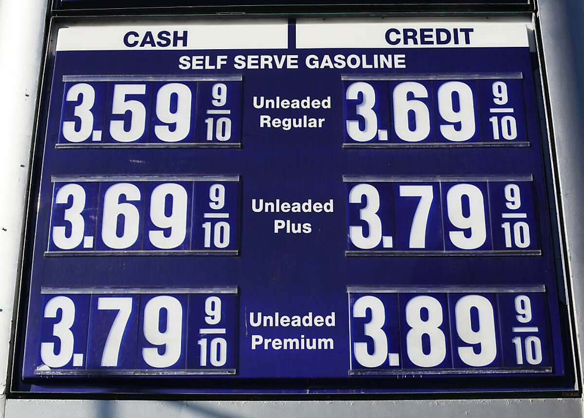A sign shows the price of gasoline, which is discounted for customers paying cash, at Twin Peaks Auto Care on November 15, 2013 in San Francisco, Calif.