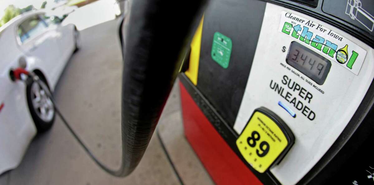 FILE This July 26, 2013 file photo shows a motorist filling up with gasoline containing ethanol in Des Moines. The Obama administration on Friday proposed to reduce the amount of ethanol in the nation's fuel supply for the first time, acknowledging that the biofuel law championed by both parties in 2007 is not working as well as expected.(AP Photo/Charlie Riedel, File)