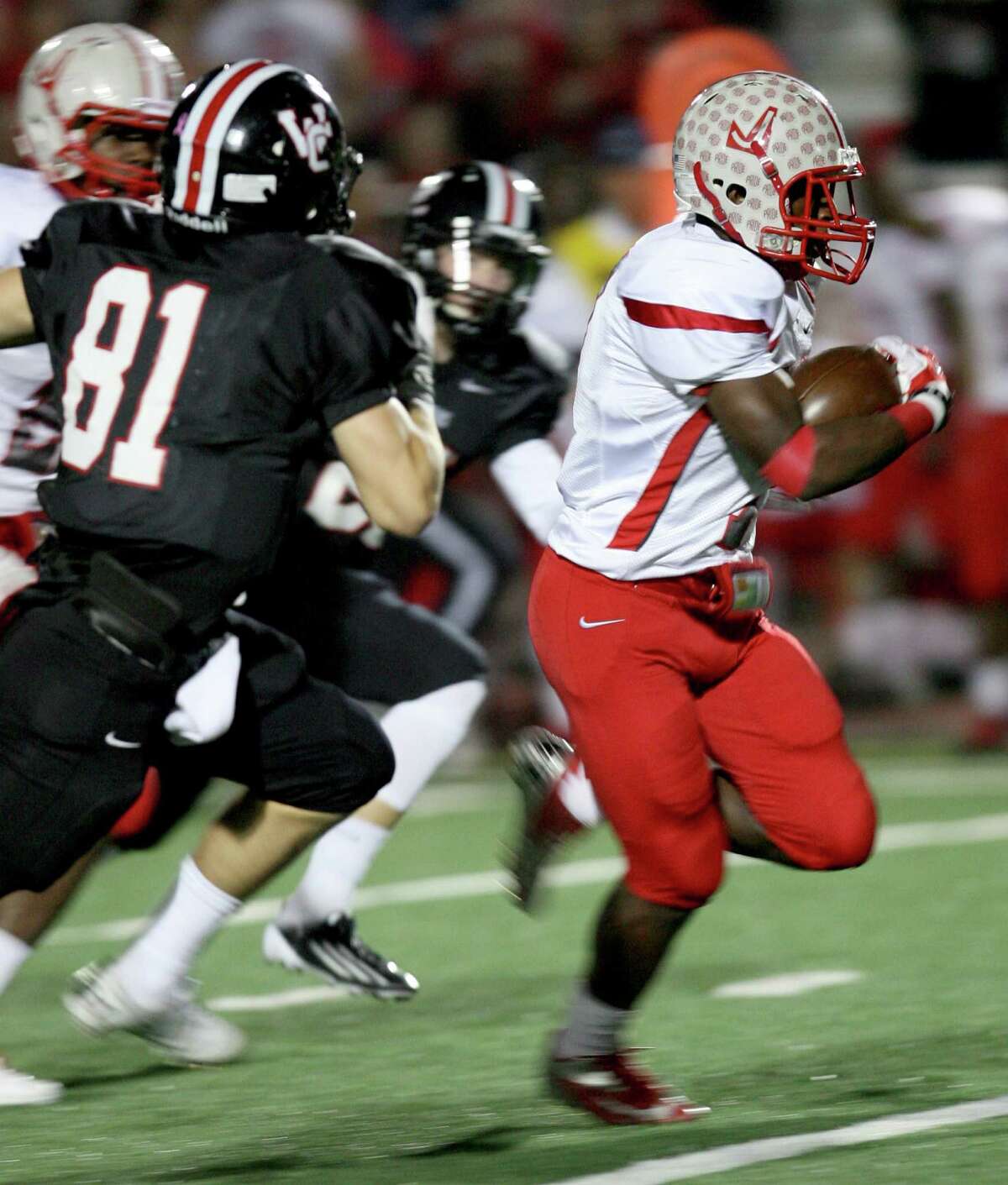 Judson High School running back Jo'von Kyle outruns Churchill defenders Nov. 15, 2013 to make the second touchdown of the game for Judson at Comalander Stadium.