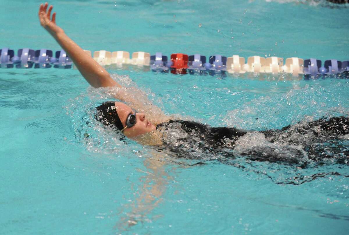 Amity's Megan Lasto races in the 200 Yard Intermediate Medley Saturday, Nov. 16, 2013 at the CIAC Open Championship at Yale's Kiputh Pool in New Haven, Conn.