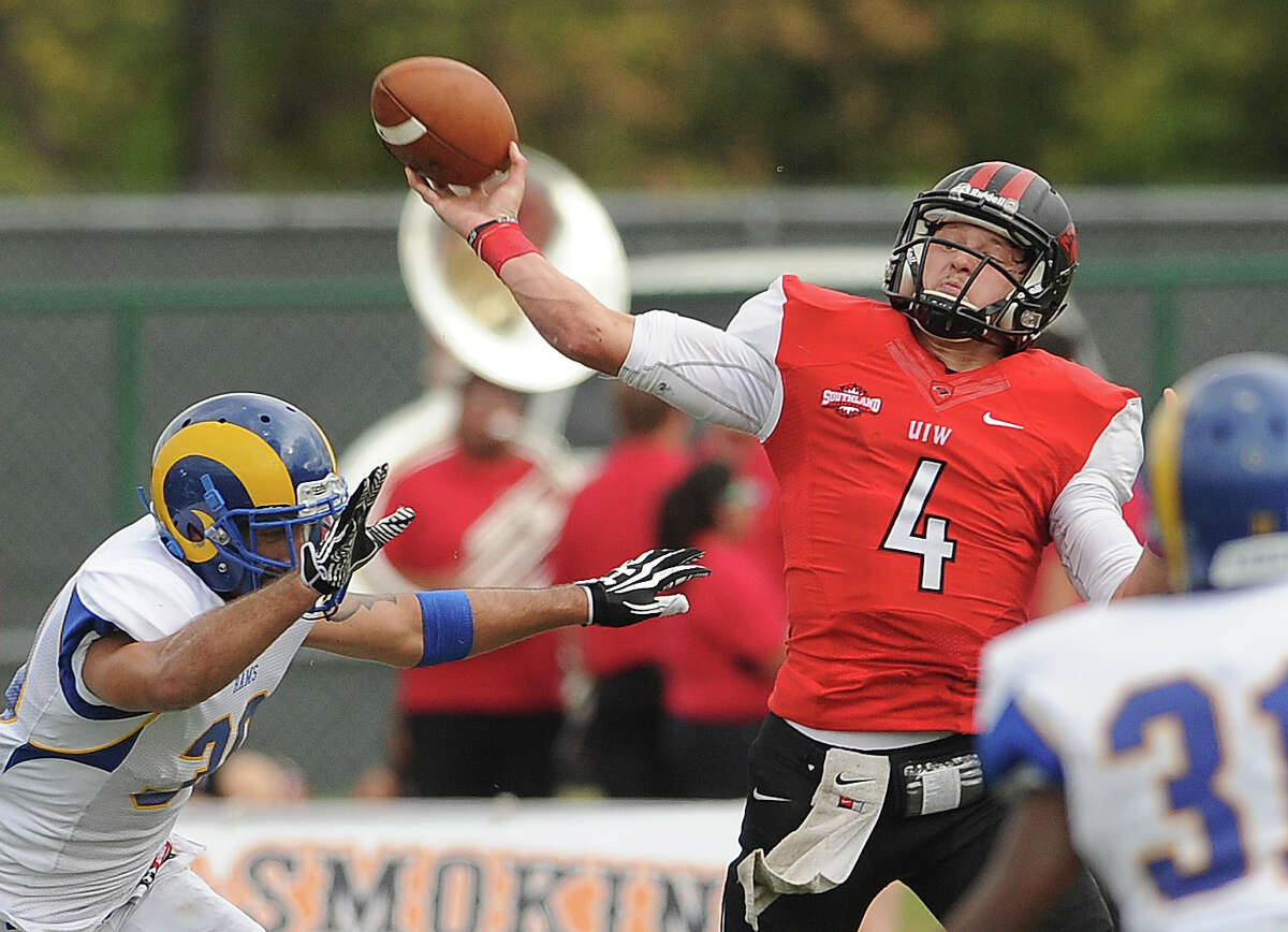Incarnate Word quarterback Trent Brittain is pressured as he attempts a pass against Angelo State during college football action at Benson Stadium on Saturday, November 16, 2013.