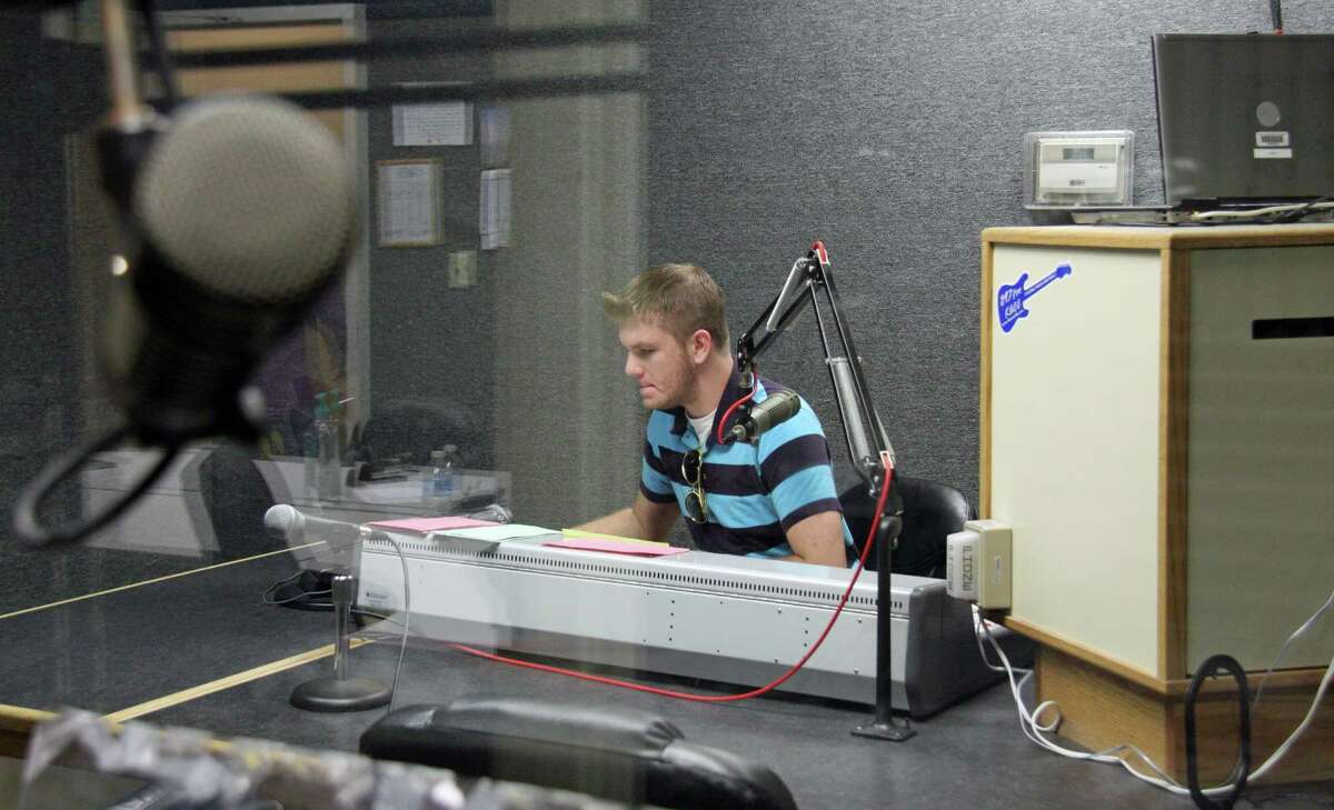 Alvin Community College student Austin Higgins mans the board at the college's rock radio station 89.7 FM KACC.