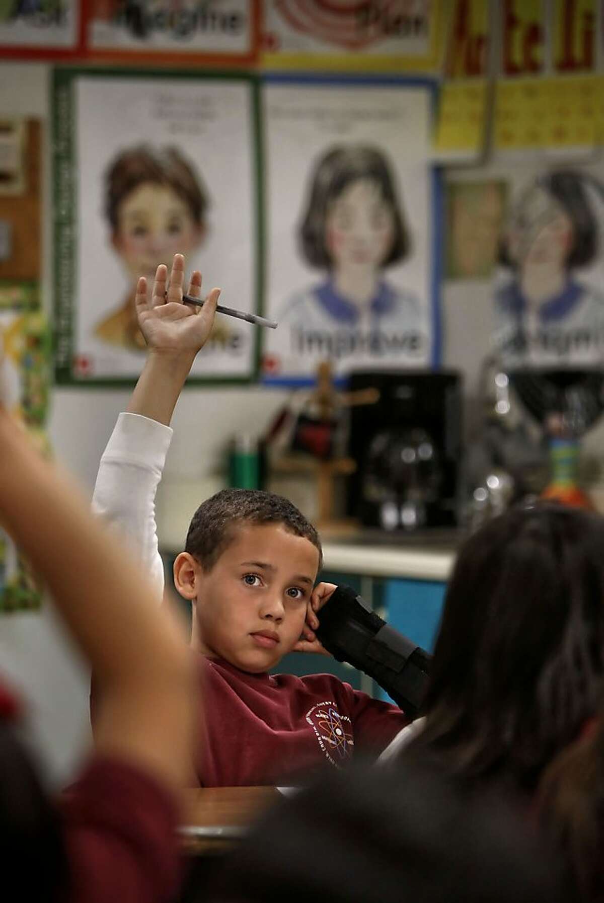 Xander Carradine, at 3rd garder in Jennifer Benis' class is ready to answer a question at the Lazear Charter Academy in Oakland, Ca., on Tuesday Nov. 12, 2013. Lazear is among 40 charter schools throughout the City of Oakland. One school board member has decided to vote against allowing any new charter schools.