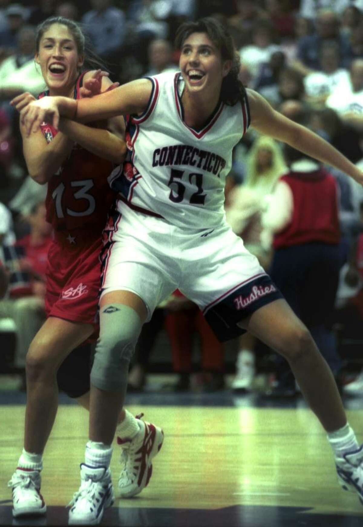 University of Connecticut basketball player Kara Wolter in action against former teammate Rebecca Lobo, member of the U.S. Olympic team, date and location unknown.
