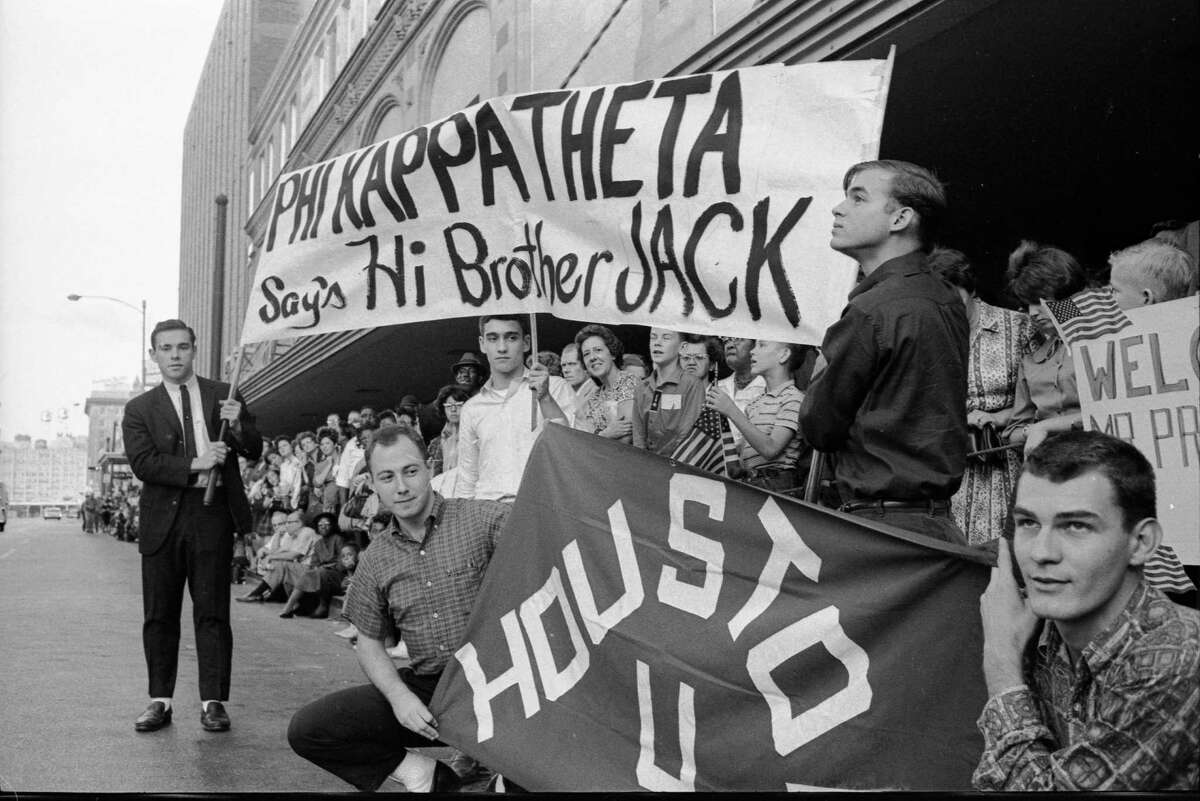 On November 21, 1963 -- the day before John F. Kennedy was assassinated -- Truxillo was among the University of Houston Phi Kappa Theta fraternity members who stood outside Houston's Rice Hotel, waiting to greet their fraternal alumni brother, the president. Left to right, holding the banner: Norman Ehrentraut, Jay Kirk and Bart Truxillo. Left to right, kneeling with the UH flag: Gene Deluke and Jim Kadlechk were outside the Rice Hotel to greet their fraternal alumni brother, Pres. John F. Kennedy.