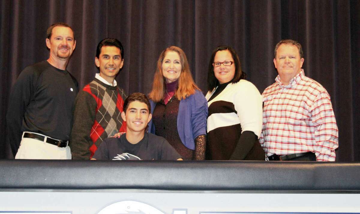 Boerne Champion senior Zander Lozano, seated, signs to play college golf at UTSA. Others are, from left, head trainer Terry Gault; Zander's parents, Omar and Cheryl Lozano; golf coach Tabitha Oates; and BISD Athletic Director Stan Leech.