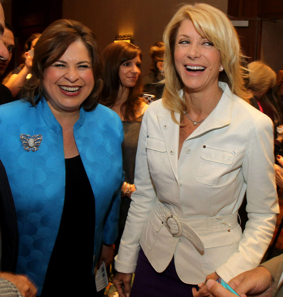 State Sen. Leticia Van de Putte rushed off a Houston stage Thursday evening to assist a woman who had fainted during a speech by state Sen. Wendy Davis. Get to know Leticia Van de Putte.Van de Putte (left) and Davis greeted supporters at a luncheon in San Antonio earlier this month.