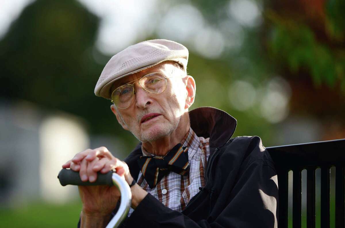 Norman Rice, the dapper and bowtied curator whose seven-decade career at the Albany Institute shaped city's vision of its past, died Friday morning at 95. Rice is pictured Oct. 11, 2013, at Albany rural Cemetery in Menands, N.Y.