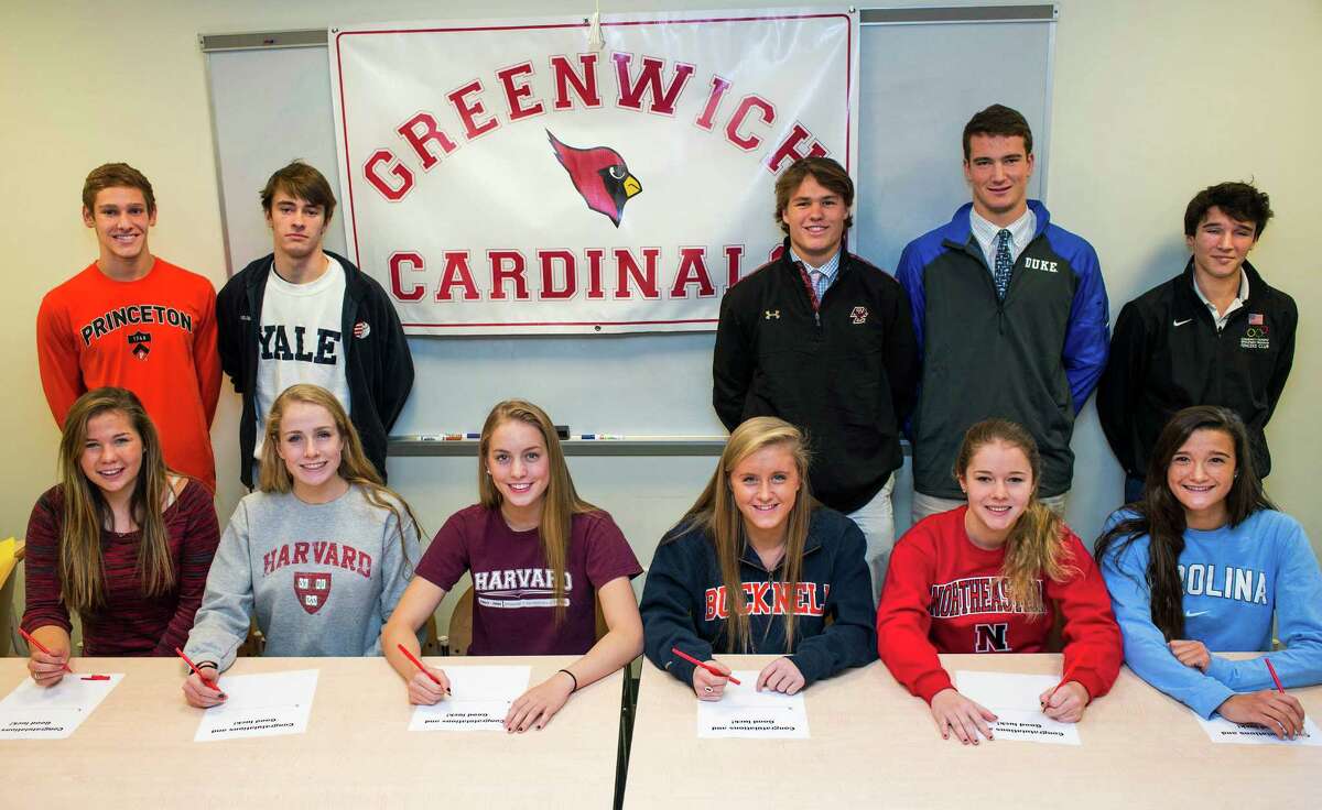 Eleven Greenwich high school athletes who have signed National letters of intent for colleges meet in the Media Center at Greenwich high school, Greenwich, CT on Wednesday, November, 20th, 2013. Left to right front row: Sarah Reswow (crew/George Washington University), Hollis Jomo (water polo/Harvard), Katie Evans (swimming/Harvard), Anna Black (track/Bucknell), Kim Hill (swimming/Northwestern University), Carolyn Paletta (lacrosse/University of North Carolina-Chapel Hill). Left to right back row: Alexander Lewis (swimming/Princeton), Thomas Kingshott (squash/Yale), Kyle Dunster (baseball/Boston College), Jack Harrington (lacrosse/Duke), Harry McGuire (fencing/University of Pennsylvania).